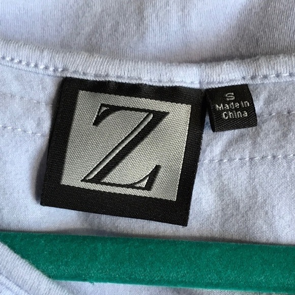 “Z” Sleeveless Ruffle Neck Blouse - Picture 3 of 6